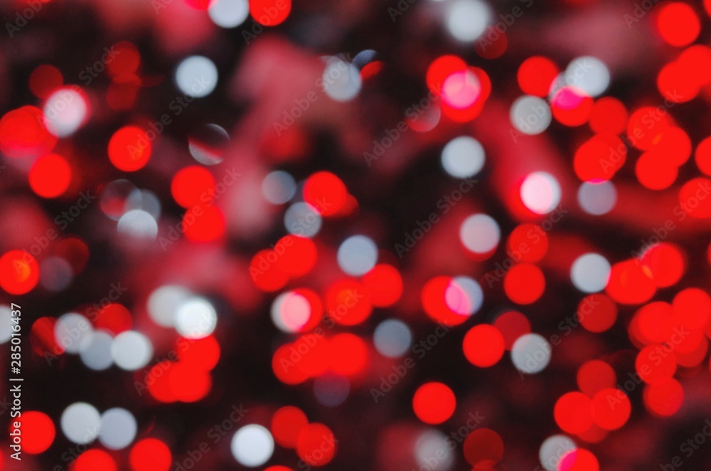 Colored lights of garlands on a blurred background. Bokeh - obrazy, fototapety, plakaty 