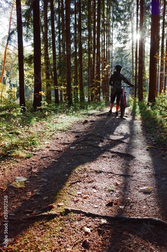 Girl and bike in the forest 