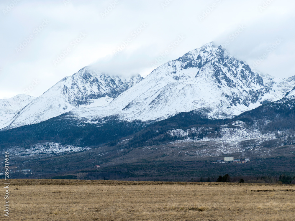 Fototapeta premium cloudy day, snowy mountain peaks, cold winter day, Tatra Mountains, Slovakia