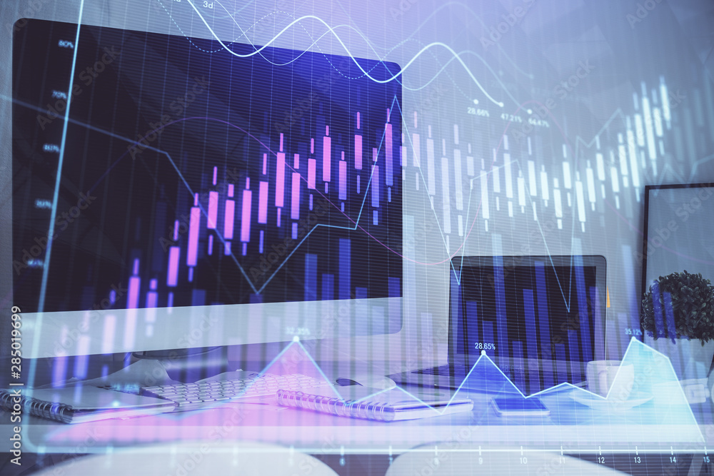 Stock market chart hologram drawn on personal computer background. Multi exposure. Concept of investment. Stock market chart hologram drawn on personal computer background. Multi exposure. Concept of investment.