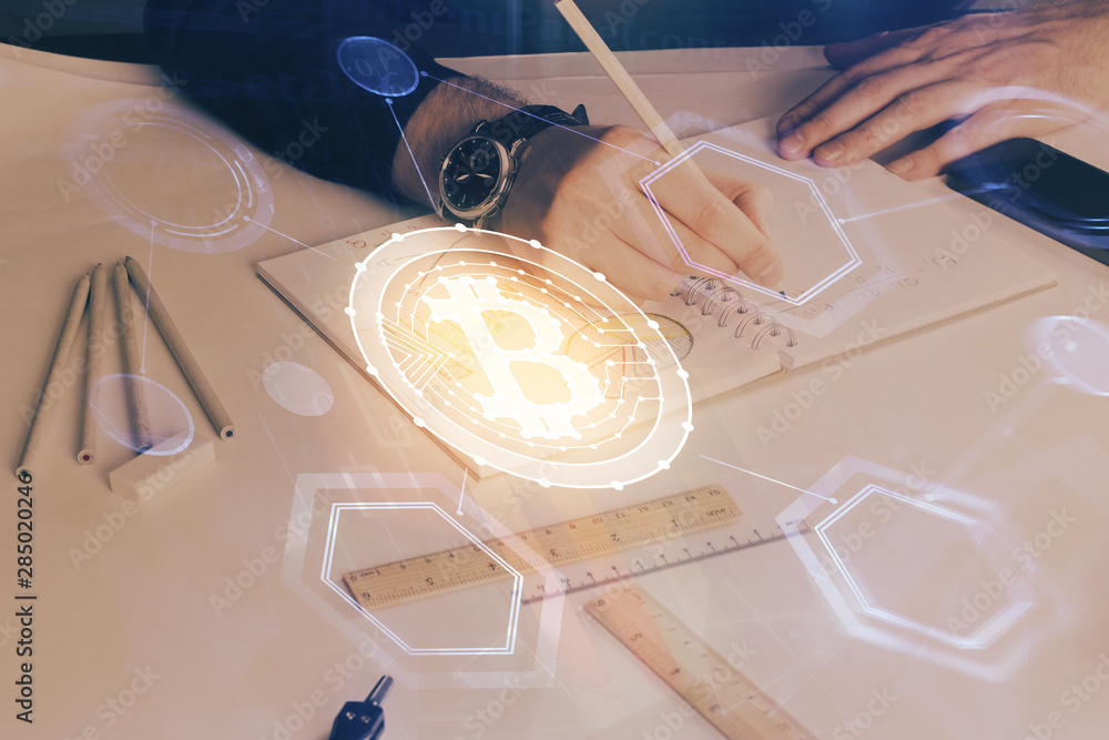 Man's hands working with notes background. Cryptocurrency and finance concept. Man's hands working with notes background. Cryptocurrency and finance concept.