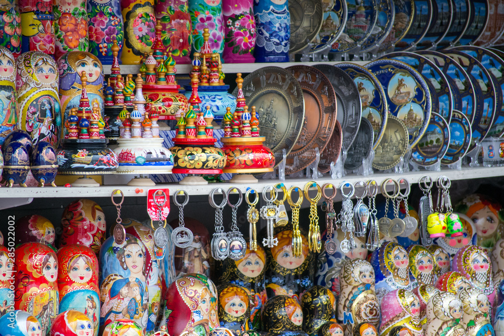 Detail of some souvenirs from Russia, found in a outdoor market in Saint Petersburg. There are colorful matryoshkas, plates and eggs