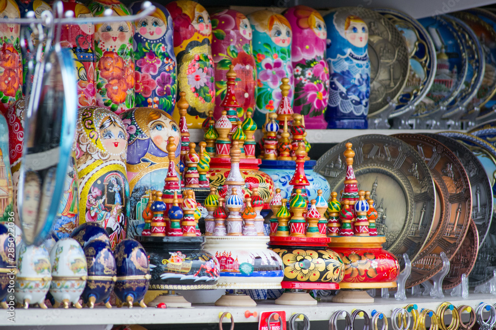 Detail of some souvenirs from Russia, found in a outdoor market in Saint Petersburg. There are colorful matryoshkas, plates and eggs