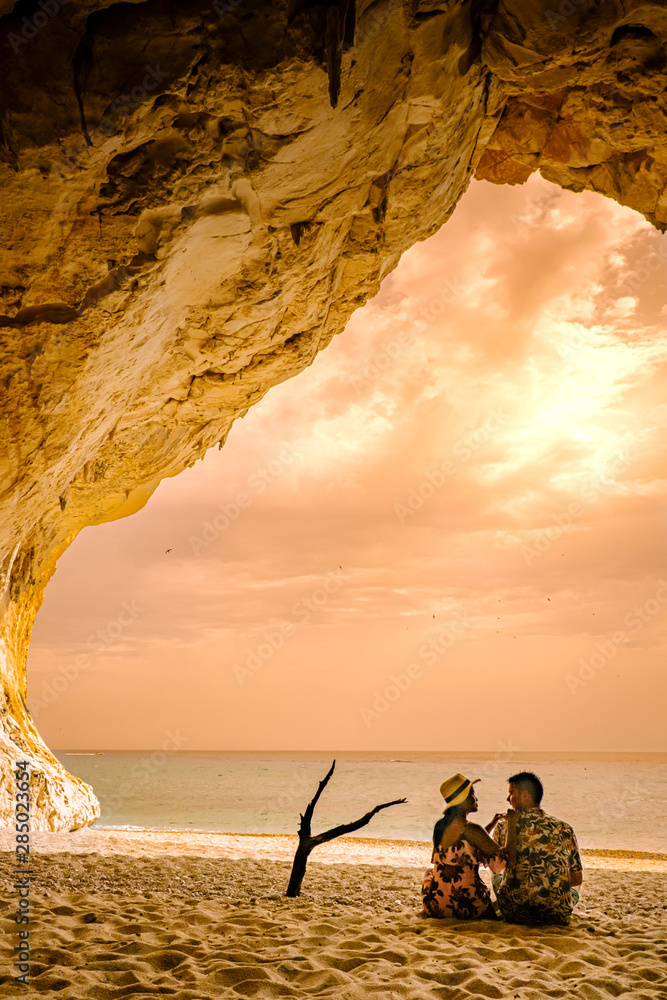 Φωτογραφία Caves of Cala Luna beach Sardinia Orosei coast, couple on the beach of Cala Luna