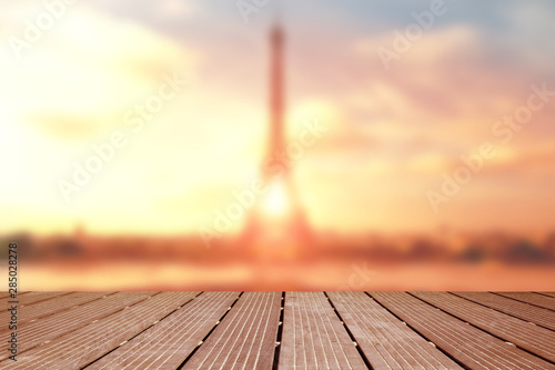 Photography blurred landscape of the eiffel tower with wooden terrace