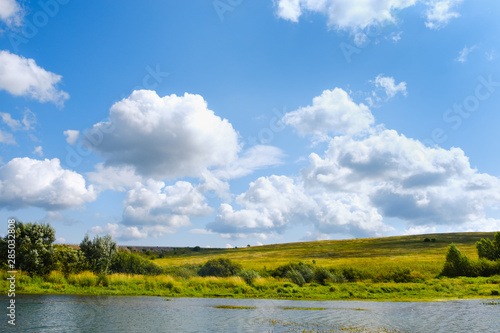 Russian open spaces. Pole. River. Sky. The clouds. Summer Russian landscapes. Road views. Summer landscape background