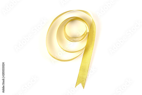 Golden ribbon isolated on white background.