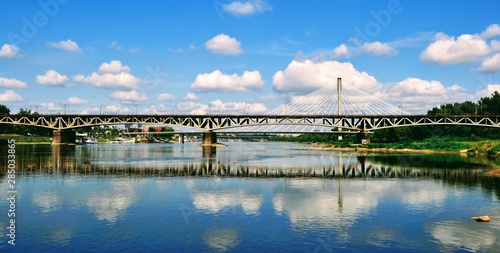 Beautiful panoramic view of Srednicowy railway Bridge and Swietokrzyski bridge in Warsaw, Poland. View from the Stadium Beach (or Poniatowka beach) in the vicinity of the National Stadium.  photo