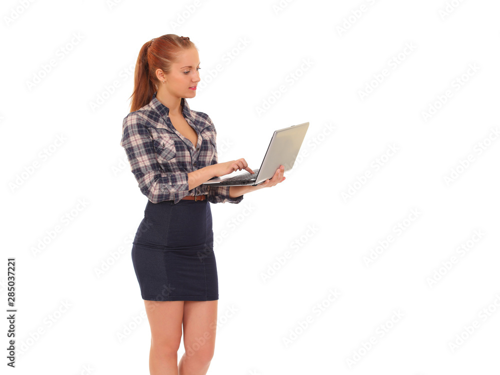 Young woman in casual clothes holding laptop Young woman in casual clothes holding laptop