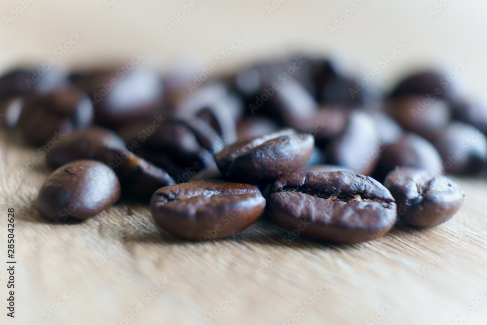 Roasted brown coffee bean Macro close up . Selective focus with copy space Roasted brown coffee bean Macro close up . Selective focus with copy space