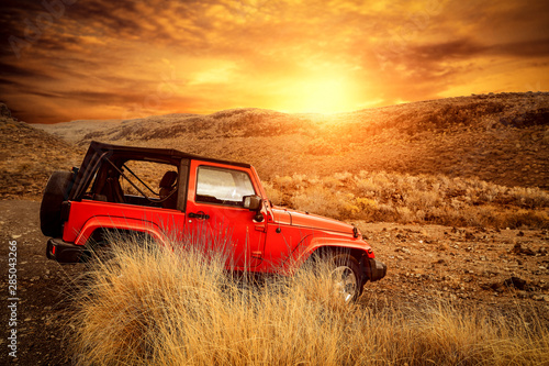 Red big autumn car and mountains landscape. 