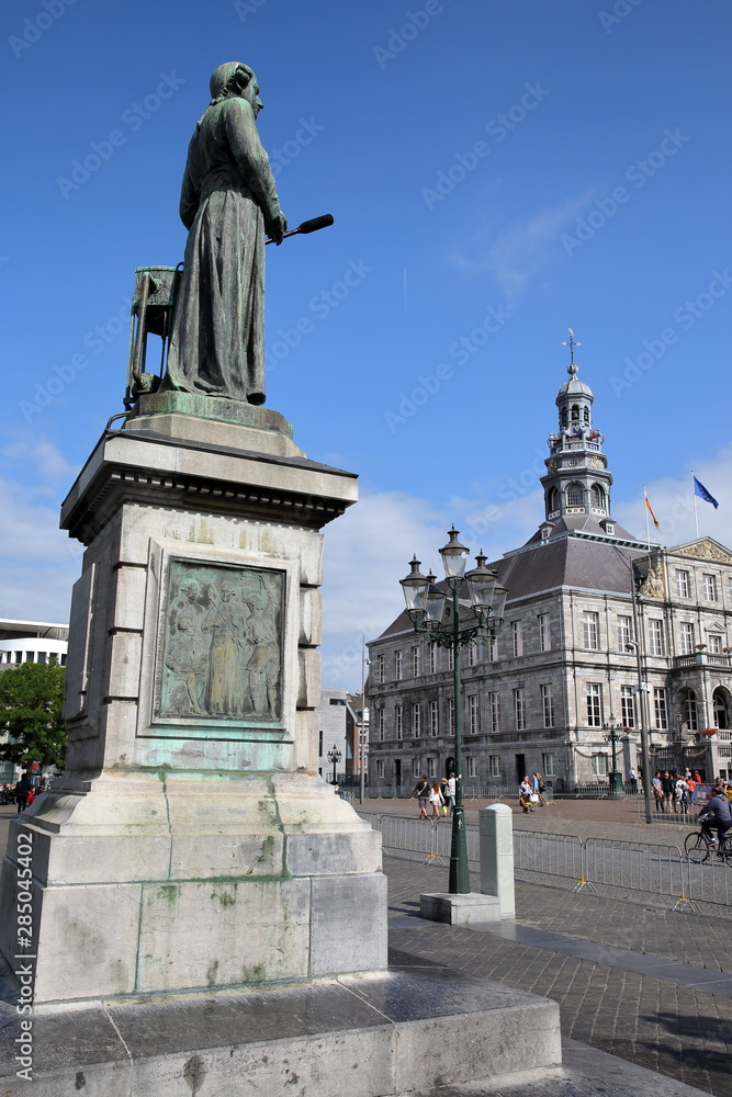 The bronze statue of Jan Pieter Minckeleers, designed by Bart van Hove and unveiled in 1904, located on Markt Square and with the City Hall (Stadhuis) in the background, Limbourg, Maastricht, Netherla