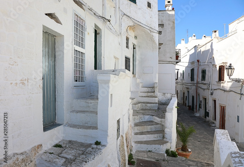 Narrow alleyway in an old Ostuni city. Apulia, Italy