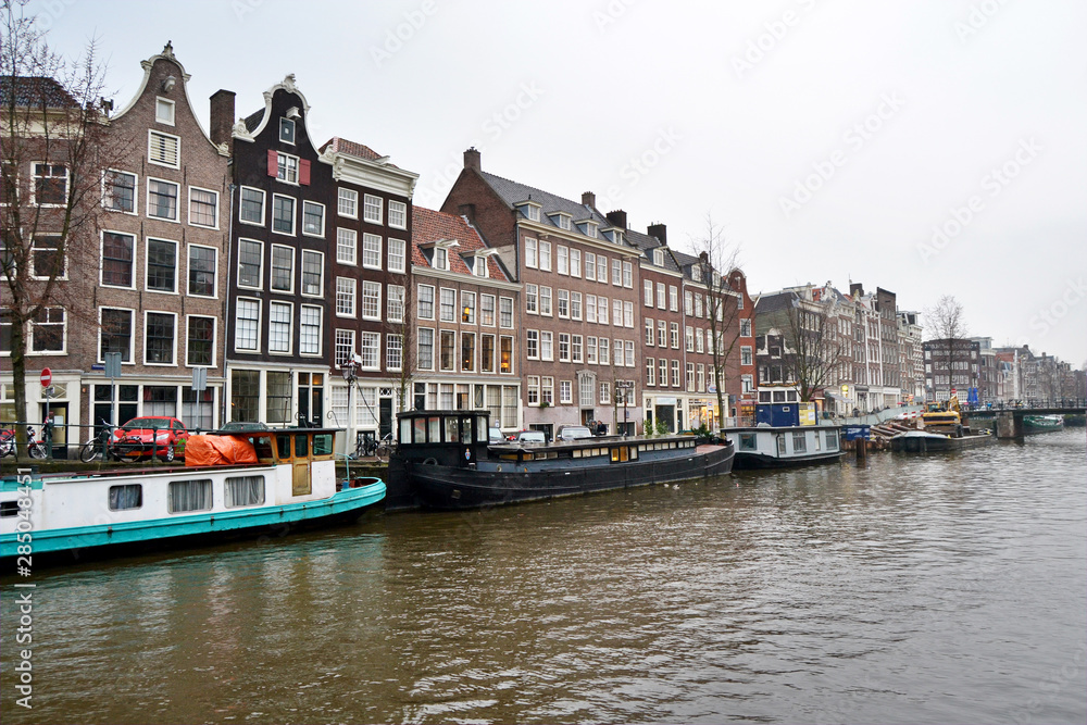 View on the crooked houses of Amsterdam from a canal, Netherlands