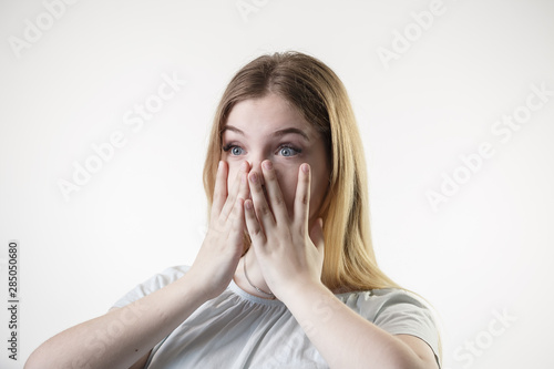 Teenager girl is surprised scared frightened showing emotions on her face