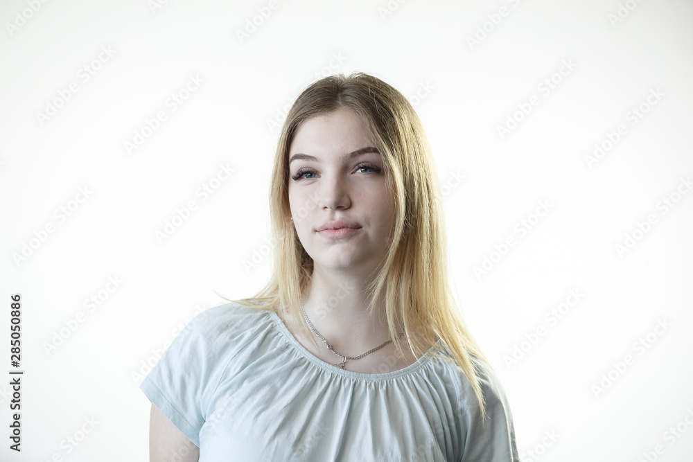 Teenager girl is thinking deciding serious on the white background Teenager girl is thinking deciding serious on the white background