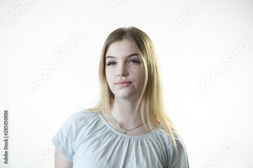 Teenager girl is thinking deciding serious on the white background
