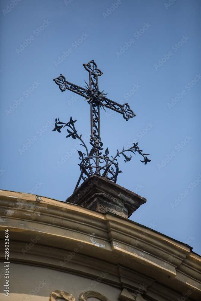 Metal cross on top of a church Metal cross on top of a church