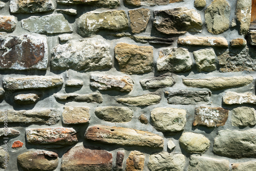 texture of masonry, a fragment of a stone wall of an ancient temple of ...