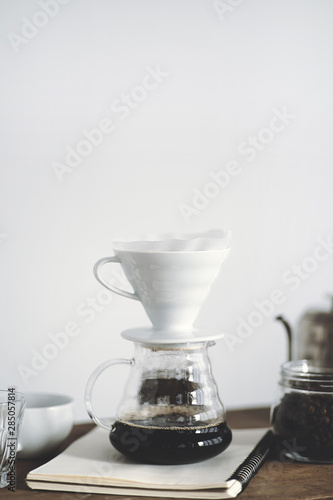 Drip coffee on a wooden bar White background