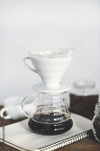 Drip coffee on a wooden bar White background