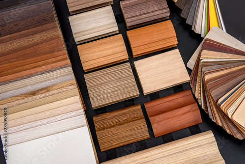 Plywood sampler in fan at wooden desk close up