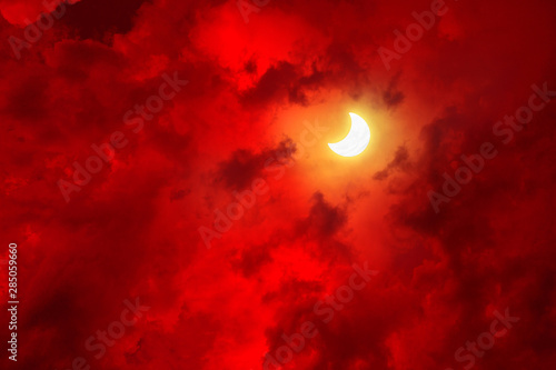 Big red clouds and moon. Abstract sky picture.