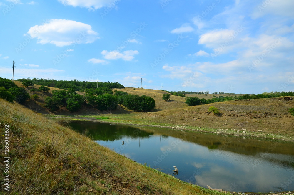 Artificial lake with a reduced water level. Artificial lake with a reduced water level.