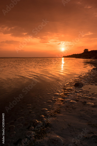 Sunset over the sea beach summer evening 