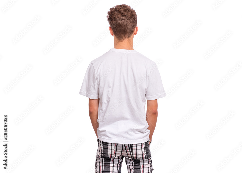 T-shirt design concept. Teen boy in blank white T-shirt, isolated on white background - back view. Mock up template for print. Child with hands in pockets - rear view. T-shirt design concept. Teen boy in blank white T-shirt, isolated on white background - back view. Mock up template for print. Child with hands in pockets - rear view.