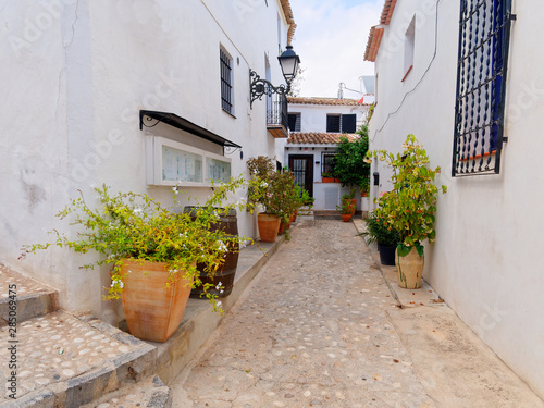 Fototapeta Naklejka Na Ścianę i Meble -  A beautiful street with beautiful white houses in Altea. Costa Blanca. Spain.