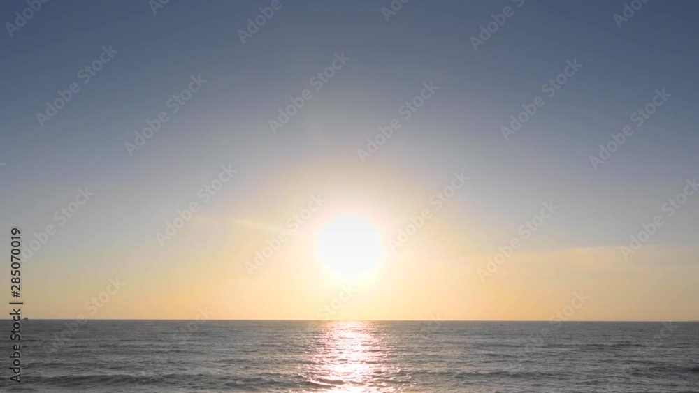 The ocean under the blue sky and the sunset in the evening The ocean under the blue sky and the sunset in the evening