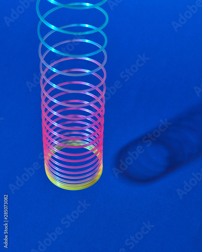 Classic colored plastic spring hungs with shadow. photo