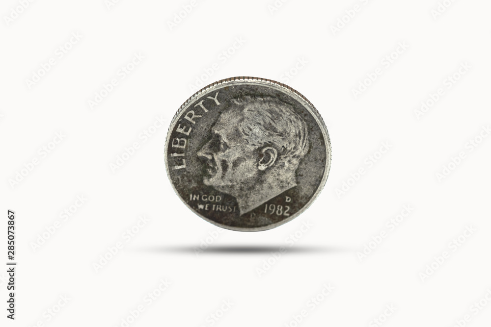 Closeup of one dime coin with shadow on white background. US dollar is worldwide currency and popular for exchange with others currency. Closeup of one dime coin with shadow on white background. US dollar is worldwide currency and popular for exchange with others currency.