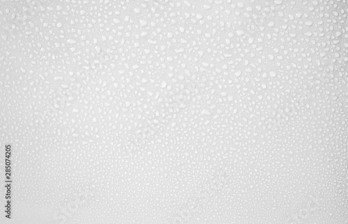 Many photos of clear water droplets on a clean white background