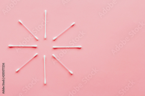 pink cotton buds on a pink background with space for text