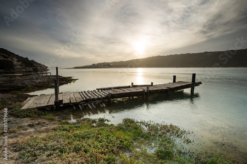 Wide angle landscape image of an old jetty on an estuary. © Dewald