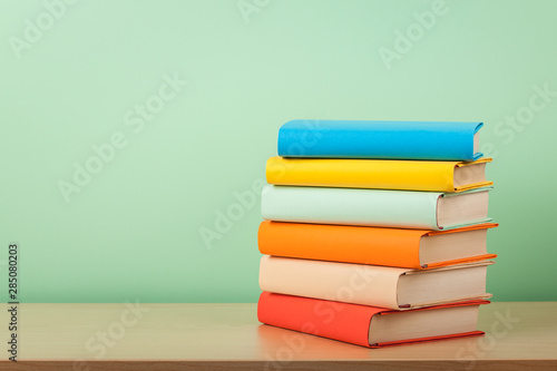 Education concept with stack of books on a table