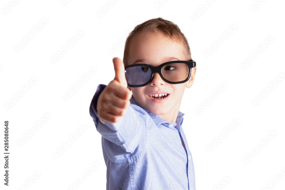 Young boy with eyeglasses showing thumbs up isolated on white background. Eye examination, education and learning concept. Young boy with eyeglasses showing thumbs up isolated on white background. Eye examination, education and learning concept.