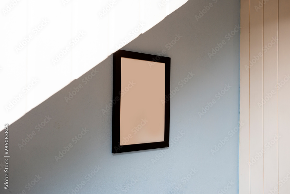 Mock up black frame on blue wall. background texture, space for text Mock up black frame on blue wall. background texture, space for text