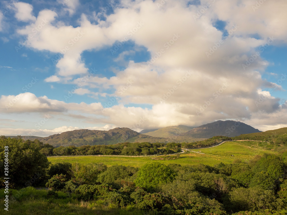 Sunny day in Connemara National park, Cloudy sky, Mountains, Green fields.