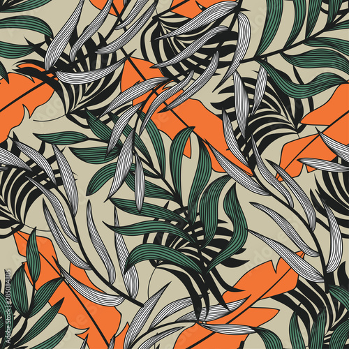 Trend abstract seamless pattern with colorful tropical leaves and plants on beige background. Vector design. Jungle print. Floral background. Printing and textiles. Exotic tropics. Summer. © EltaMax99