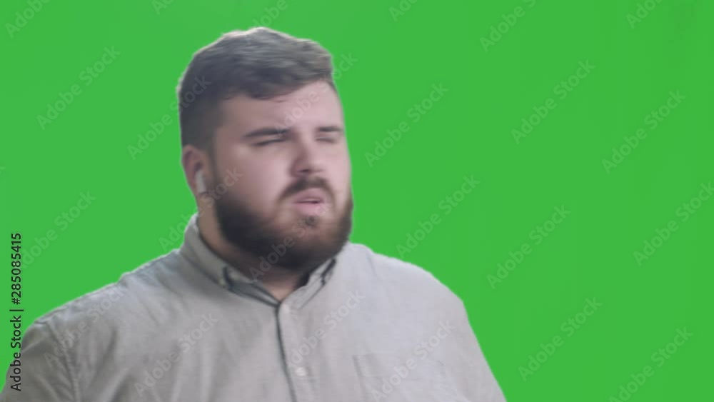 Fat young man dancing on a green screen. 4k, close-up Fat young man dancing on a green screen. 4k, close-up