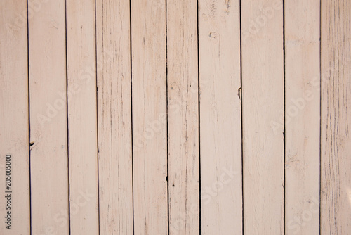 Background texture of old beige painted wooden lining boards wall