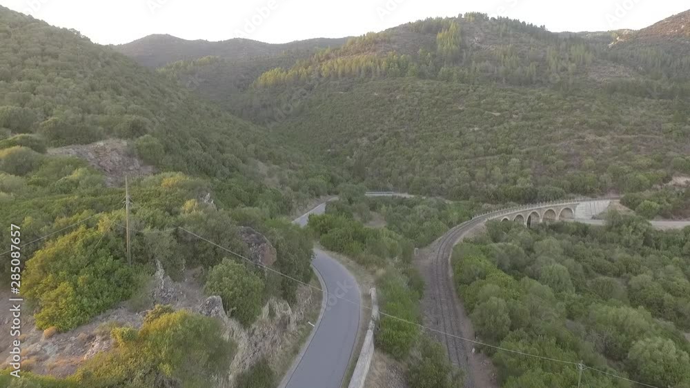 ancient railway in the woods at the sunset seen from above with the drone ancient railway in the woods at the sunset seen from above with the drone