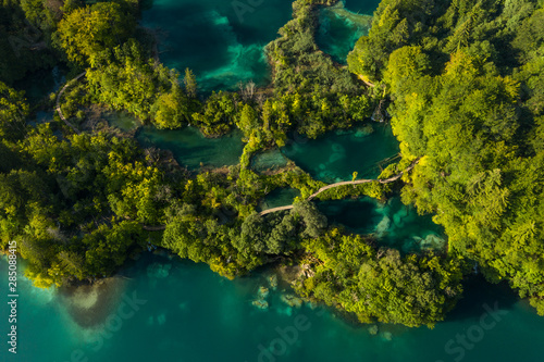 Aerial view of turquoise waters of Plitvice Lakes on a sunny summer day. Plitvice National Park, Croatia.