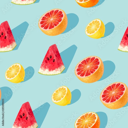 Seamless pattern with grapefruit and lemon slices