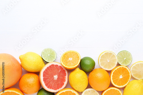 Citrus fruits on white wooden table