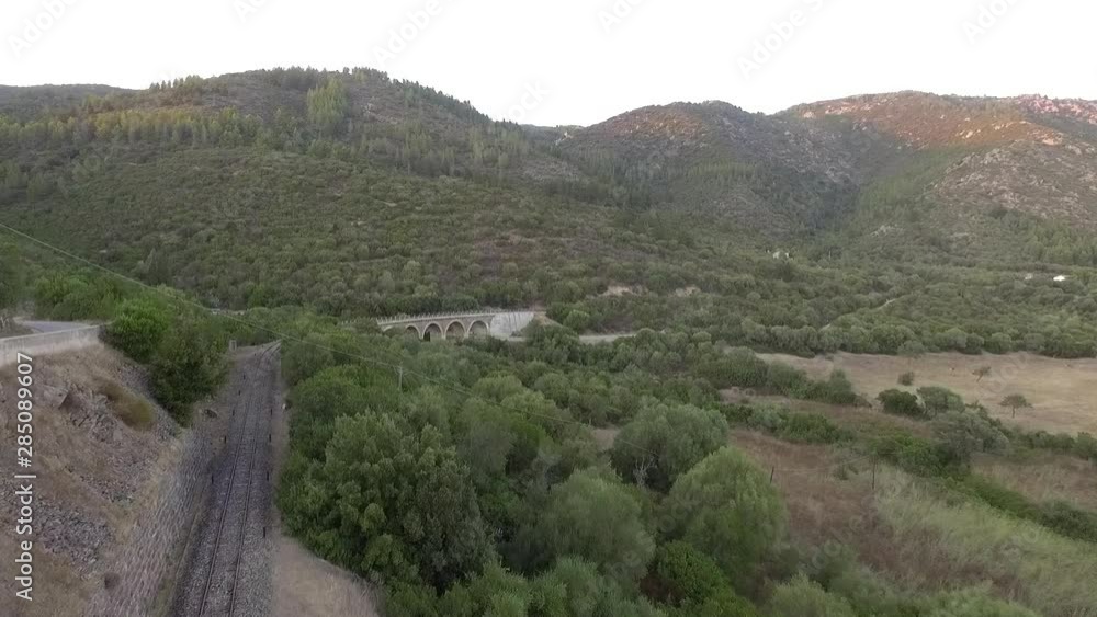 ancient railway in the woods at the sunset seen from above with the drone ancient railway in the woods at the sunset seen from above with the drone