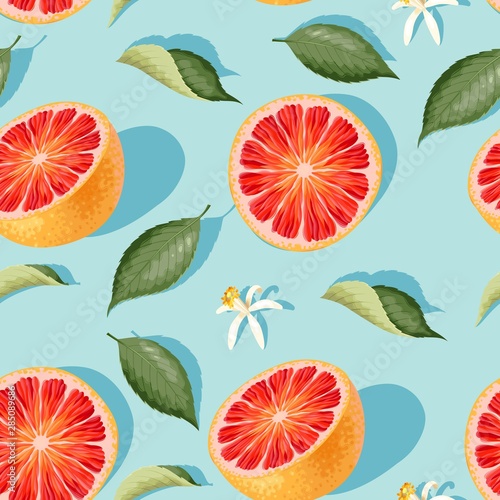 Seamless pattern with grapefruit slices and leaves